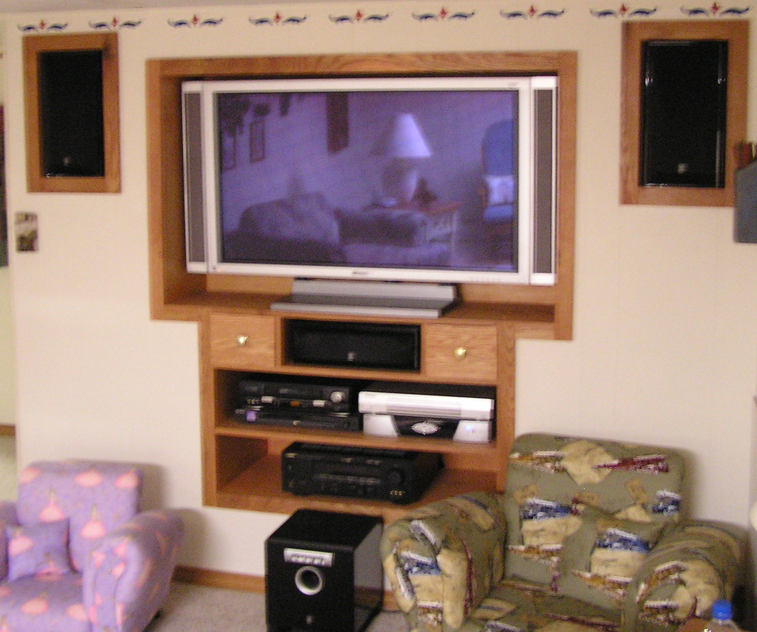 Content is oak and birch. Speaker enclosures match the main case. Unit is flush mounted with the wall.